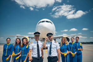 a group of people in uniform standing in front of a plane